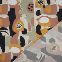 Load image into Gallery viewer, EcoVero Viscose fabric with printed abstract shapes pattern shown with reverse side of fabric
