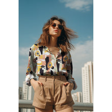 Load image into Gallery viewer, Lady wears a button up shirt made with the Abstract Ecovero Viscose fabric