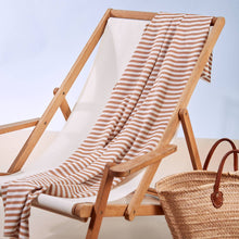 Load image into Gallery viewer, Sunray Stripe Viscose Modal fabric draped over deckchair