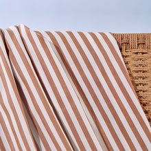 Load image into Gallery viewer, Close up of Sunray Stripe Viscose Modal fabric draped over wicker chair