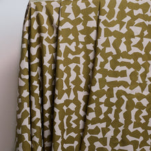Load image into Gallery viewer, Atelier Brunette's Ekko Viscose fabric hangs to show an abstract blocks pattern print