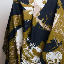 Load image into Gallery viewer, Atelier Brunette's Mira Viscose fabric hangs to show drape, with an abstract brushstrokes pattern print