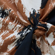 Load image into Gallery viewer, Atelier Brunette's Mira Viscose fabric shown with a swirl