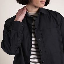 Load image into Gallery viewer, Model wears an open shirt over. tee; shirt made with Oxford Cotton Fabric