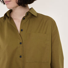 Load image into Gallery viewer, Model wears a shirt with chest patch pocket detail, made using Oxford Cotton Fabric