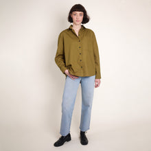 Load image into Gallery viewer, Model wears long-sleeve button up shirt, made using Oxford Cotton Fabric
