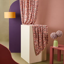 Load image into Gallery viewer, Brushstroke printed viscose twill fabric hangs from above onto a block stand with heavy-drape