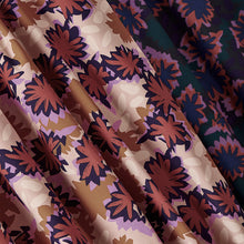 Load image into Gallery viewer, Two different colour-ways of abstract waterlily print on viscose fabrics hang with a heavy drape