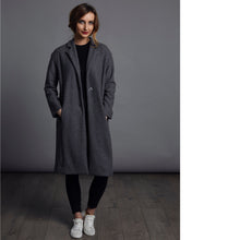 Load image into Gallery viewer, Lady wears a wool coat with hands in pocket opened