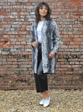 Load image into Gallery viewer, Lady wears a cocoon shaped Wimborne coat open.
