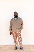 Load image into Gallery viewer, Model wears a collared Beachcomber jacket fastened up, with 2 chest patch pockets