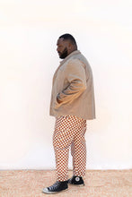 Load image into Gallery viewer, Side view of model wearing collared Beachcomber jacket with inset welt pockets