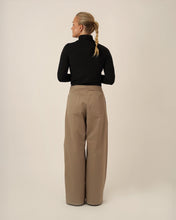 Load image into Gallery viewer, Back view of model wearing Bermuda Pants with patch pockets at hip level