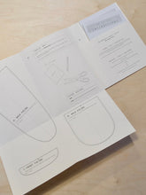 Load image into Gallery viewer, Zero Waste Tie Top Sewing Pattern Booklet opened to reveal template pieces