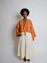Load image into Gallery viewer, Lady wears a long sleeved, Zero Waste Tie Top with ties V neckline