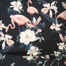 Load image into Gallery viewer, Cotton fabric with floral and flamingo pattern, displayed with drape