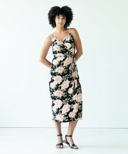 Load image into Gallery viewer, Lady wears the Calvin wrap dress with waist tie in floral print fabric