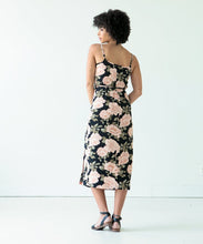 Load image into Gallery viewer, Back view of lady wearing the Calvin wrap dress with waist tie in floral print fabric
