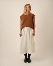 Load image into Gallery viewer, Model wears the Claude Skirt: an ankle length skirt with elasticated waistband, worn with sleeveless jumper tucked into waistband