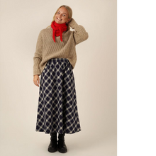 Load image into Gallery viewer, Model wears the Claude Skirt; an ankle length skirt with elasticated waistband, worn with jumper tucked into waistband