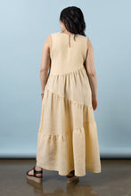 Load image into Gallery viewer, Back view of model wearing Azure Dress: a sleeveless top with asymmetric tiered skirt