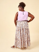 Load image into Gallery viewer, Back view of model wearing Azure sleeveless top with Azure asymmetric tiered skirt
