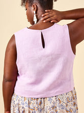 Load image into Gallery viewer, Back view of model wearing Azure Top, with keyhole fastening at centre back neckline