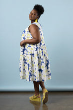 Load image into Gallery viewer, Side profile of model wearing Azure dress: a sleeveless top, with asymmetric above knee length skirt