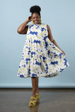 Load image into Gallery viewer, Model wears Azure dress: a sleeveless top, with asymmetric above knee length skirt, holds out skirt