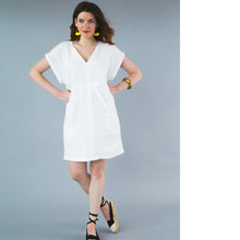 Load image into Gallery viewer, Lady stands with hands on hips, wearing an above the knee kaftan dress