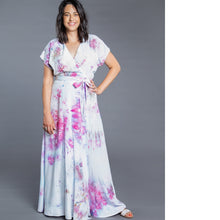Load image into Gallery viewer, Lady wears a full length Elodie Wrap Dress