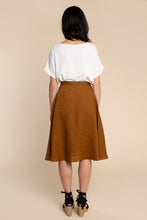 Load image into Gallery viewer, Back view of lady wearing Fiore Skirt, below-knee flare skirt
