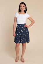 Load image into Gallery viewer, Lady wears Fiore Skirt, a knee length flare skirt