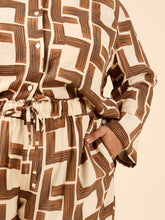 Load image into Gallery viewer, Pyjama set worn with shirt tucked into trousers showing a drawstring waist with hand in side hip pocket