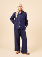Load image into Gallery viewer, Lady wears pyjama set in stripey fabric, hand in trousers side inseam pocket