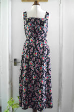 Load image into Gallery viewer, Sleeveless dress with square neckline displayed on mannequin; made with Floral Viscose fabric