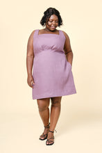Load image into Gallery viewer, Model wears the sleeveless version of the Pauline dress; a square neckline, with thick straps, above-knee length
