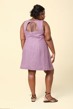 Load image into Gallery viewer, Back view of model wearing the sleeveless version of the Pauline dress; keyhole back with ties at the neck, above-knee length