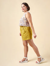 Load image into Gallery viewer, Side profile of model wearing Sepia Shorts with large patch pockets, and paperbag, drawstring waist.