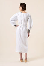 Load image into Gallery viewer, Back view of lady wearing Jo Dress with its croissant shaped sleeeves