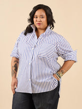 Load image into Gallery viewer, Lady wears oversize style button up shirt with the collar styled to be stood up
