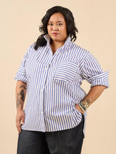 Load image into Gallery viewer, Lady wears oversize style button up shirt with the collar styled to be stood up