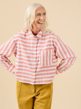 Load image into Gallery viewer, Lady wears a short cropped button up shirt in stripey fabric, and single chest patch pocket
