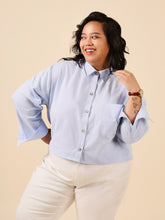 Load image into Gallery viewer, Lady wears a cropped button up shirt with single patch pocket