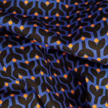 Load image into Gallery viewer, Organic cotton fabric crumpled up, with print of stems and dots in tessellating pattern