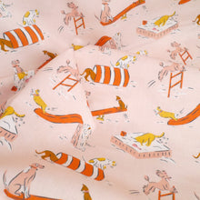 Load image into Gallery viewer, Organic cotton fabric crumpled up with print of cartoon dogs playing on playground apparatus