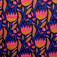 Load image into Gallery viewer, Organic cotton fabric with bold print of tessellating flowers
