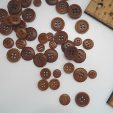 Load image into Gallery viewer, Scattering of 4-hole corozo buttons in three different sizes