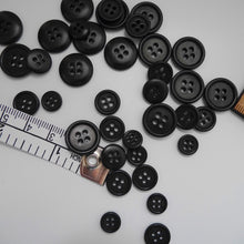 Load image into Gallery viewer, Scattering of 4-hole corozo buttons in three different sizes