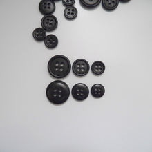 Load image into Gallery viewer, 4-hole corozo buttons shown in three different sizes, one side shows a smooth domed side, the other shows a flat with edged rim
